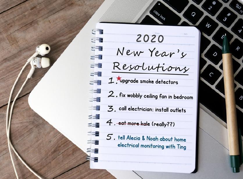 notepad and pen on laptop keyboard, new year's resolutions
